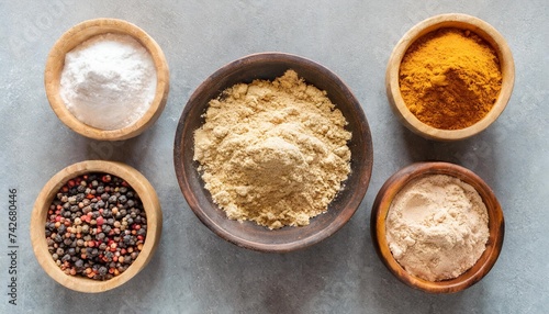 different powders powdery substances in bowls and loose isolated over a transparent background natural cosmetics or ingredients top view flat lay