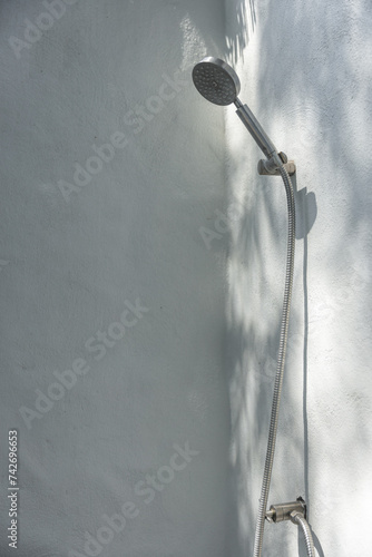 Shower head with white wall