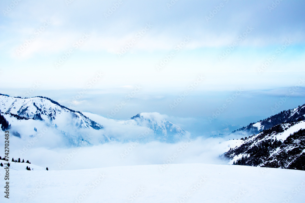 panorama of mountains. clouds on top of mountains