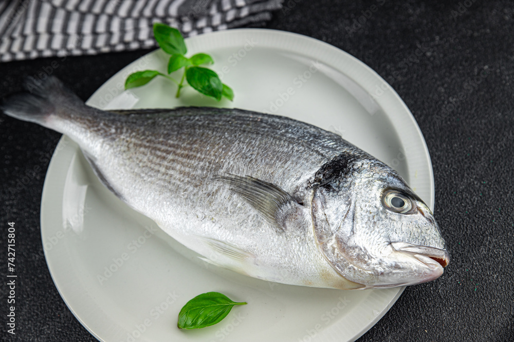 sea bream fish raw seafood fresh eating cooking meal food snack on the table copy space food background rustic top view sea bream fish raw seafood fresh eating cooking meal food snack on the table copy space food background rustic top view