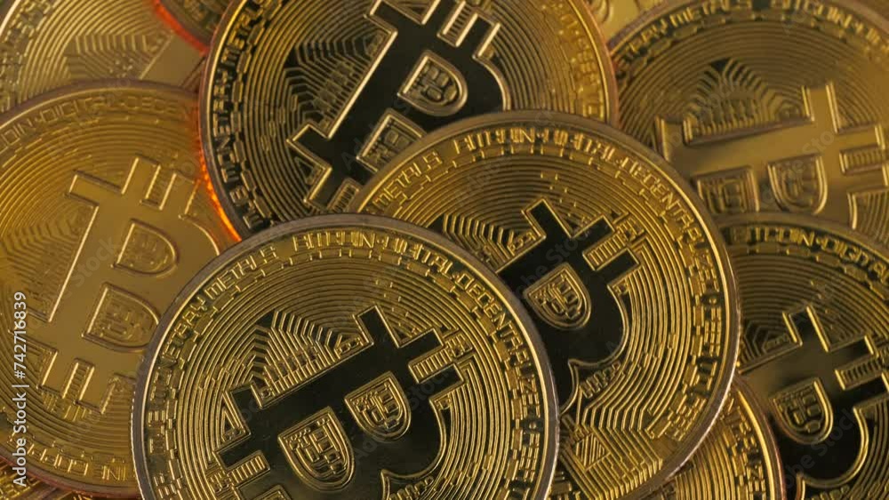 Bunch of bitcoins gold coins rotate in circle, top view. Background video. Copy Space. Concept of exchange market. Bunch of bitcoins gold coins rotate in circle, top view. Background video. Copy Space. Concept of exchange market.