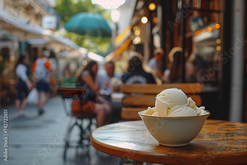 Ice-cream bowl with delicious appetizing ice cream on table in street ice cream parlor. Ordering food delicious dessert outdoors. AI Generative. Blurred people in background