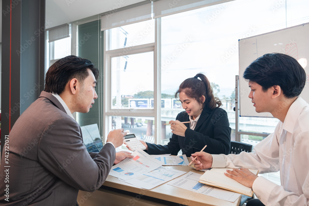 The Asian business team brainstormed and discussed work planning. Financial or statistical figures of the company in the conference room The Asian business team brainstormed and discussed work planning. Financial or statistical figures of the company in the conference room