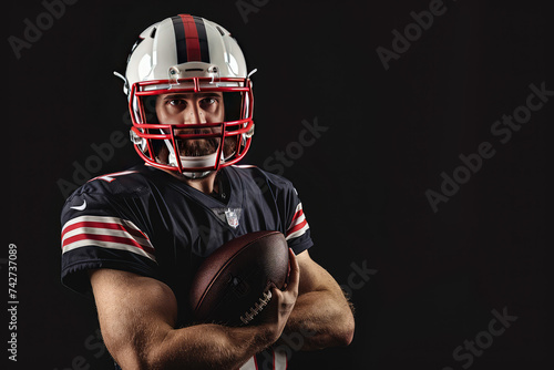 Portrait American football sportsman player on black background © Kitta