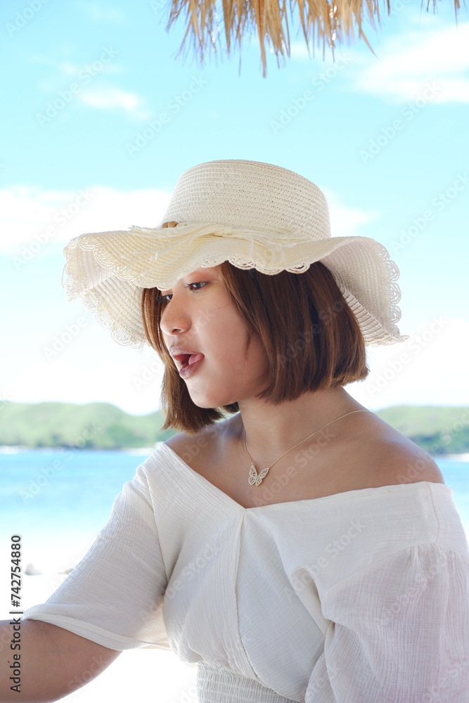 person, sea, happiness, caucasian, female, ocean, sun, tropical, young, beauty, blue, girl, holiday, lifestyle, nature, sky, vacation, water, beach, lombok, summer, travel, back, hat, joy, jump, laugh