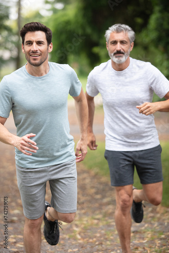 two athletic guys in sportswear running