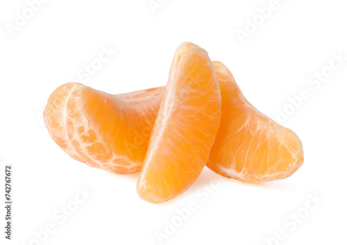 Pieces of fresh ripe tangerine isolated on white
