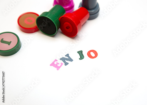 colored letters and stamps on a white background