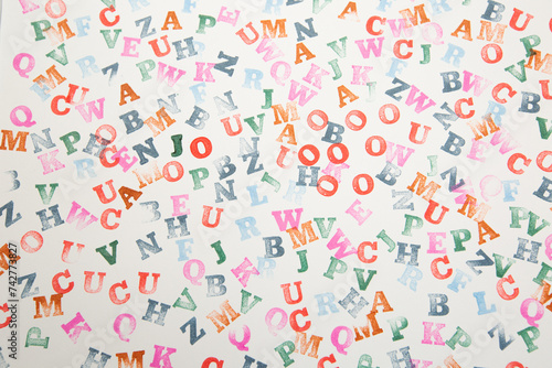 pattern with color letters made with a stamp