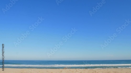Wide beach, sea and blue sky