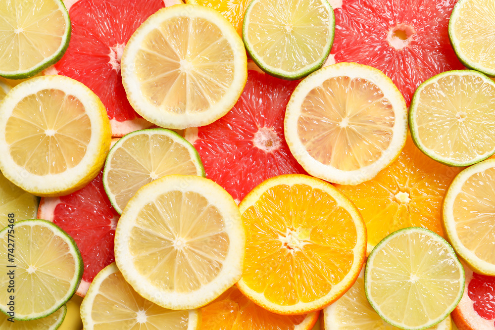 Different sliced citrus fruits as background, top view Different sliced citrus fruits as background, top view