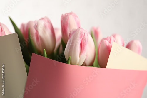 Fototapeta Naklejka Na Ścianę i Meble -  Beautiful bouquet of fresh pink tulips on blurred background, closeup