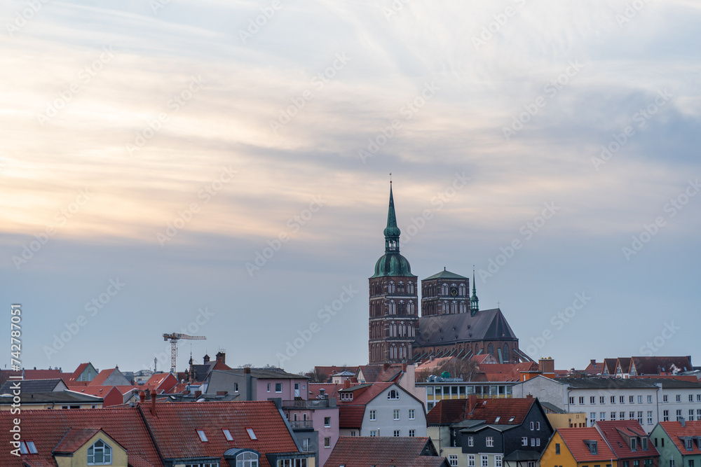 View from the parking garage at the seaport towards Stralsund old town Saint Nikolai Church at sunset; Stralsund; Germany
