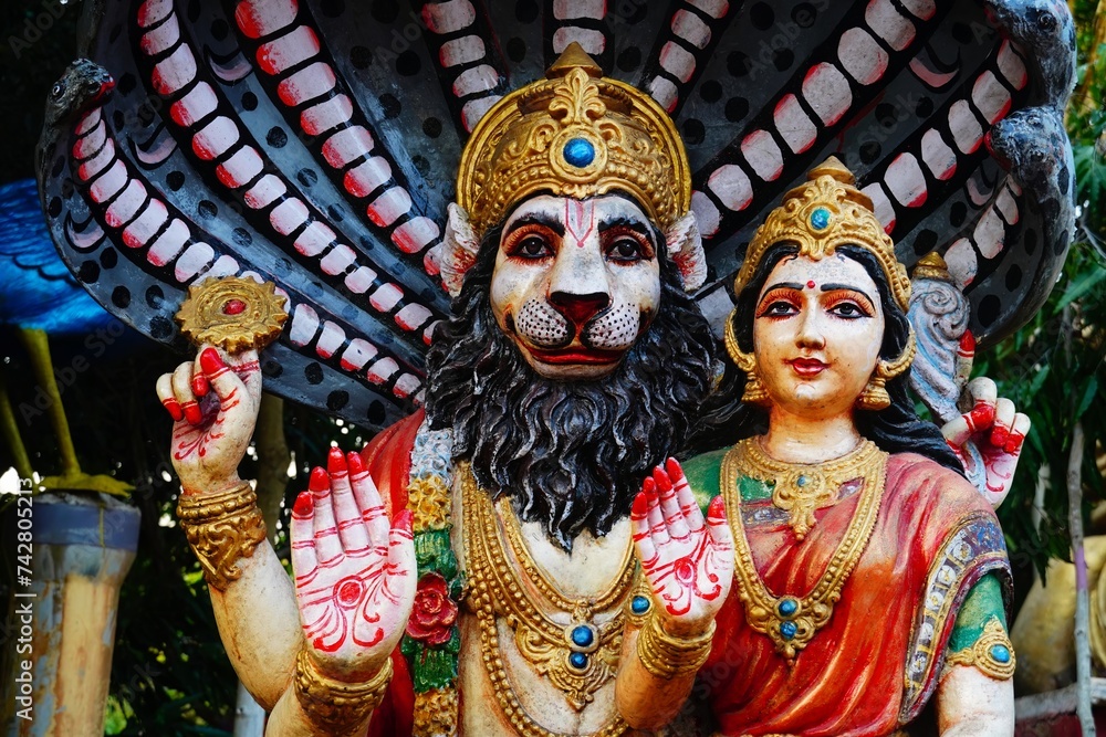 figurine of narsimha god with goddess