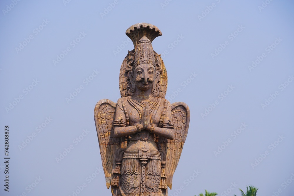a rock statue of guruda deva
