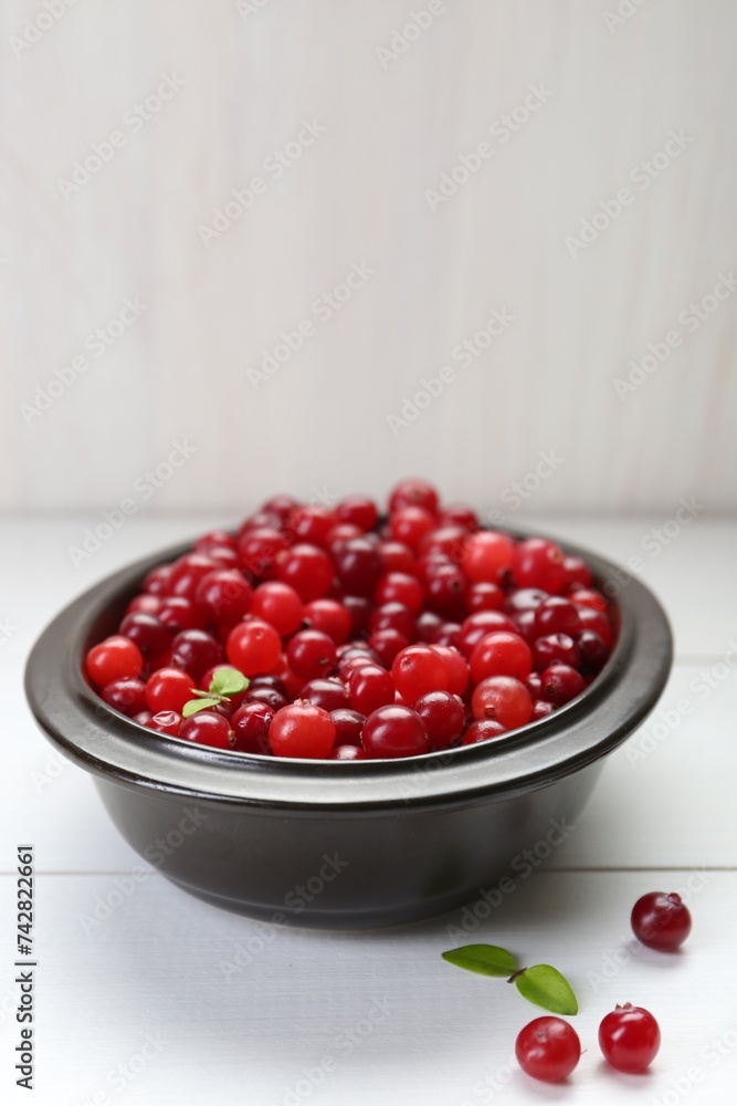Fresh ripe cranberries on white wooden table, space for text Fresh ripe cranberries on white wooden table, space for text