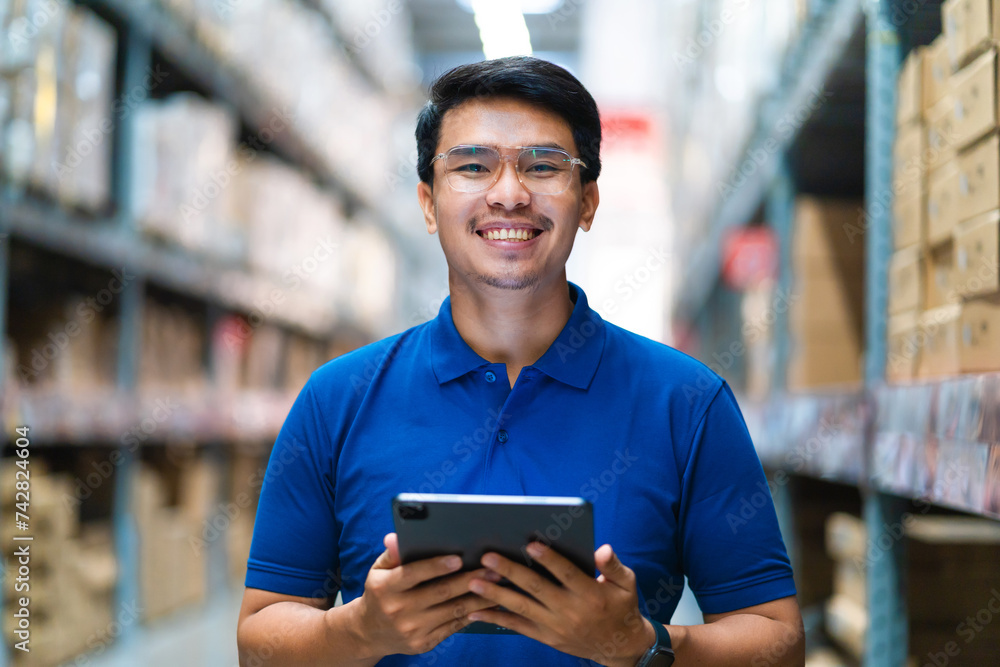 Warehouse employee who is confident in a large warehouse. Logistics distribution center concept. logistics system distribution center. Warehouse employee who is confident in a large warehouse. Logistics distribution center concept. logistics system distribution center.