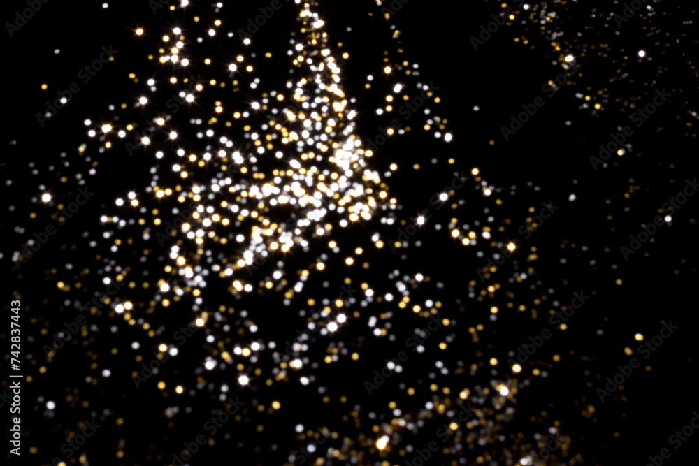 Golden and silver blurred bokeh lights on black background. Glitter sparkle stars for celebrate. Overlay for your design Golden and silver blurred bokeh lights on black background. Glitter sparkle stars for celebrate. Overlay for your design
