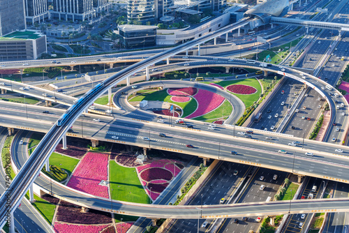 Dubai crossroads of Sheikh Zayed Road highway interchange traffic near Burj Khalifa with metro