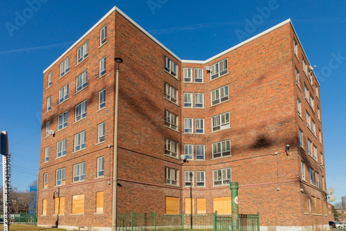 Photography A partly boarded up apartment building in the downtown east end of Toronto still shows signs of family life