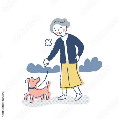 犬の散歩中に疲れてため息をつくシニア女性