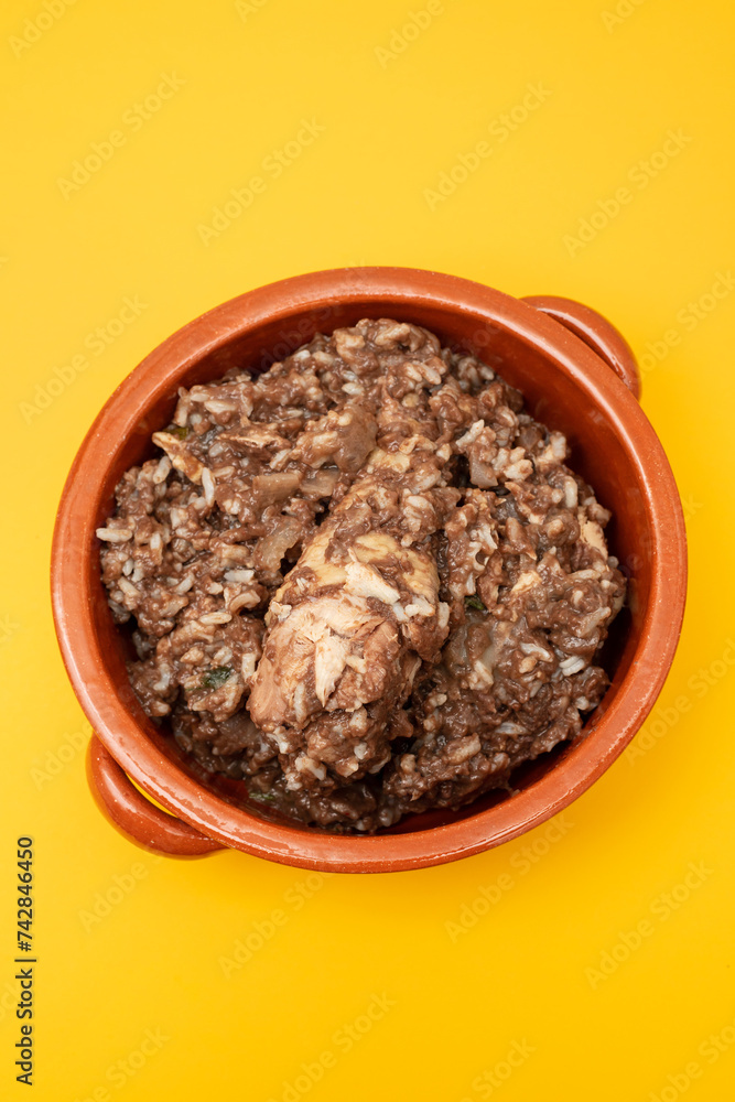 Typical portuguese dish chicken with rice in ceramic dish. Typical portuguese dish chicken with rice in ceramic dish.
