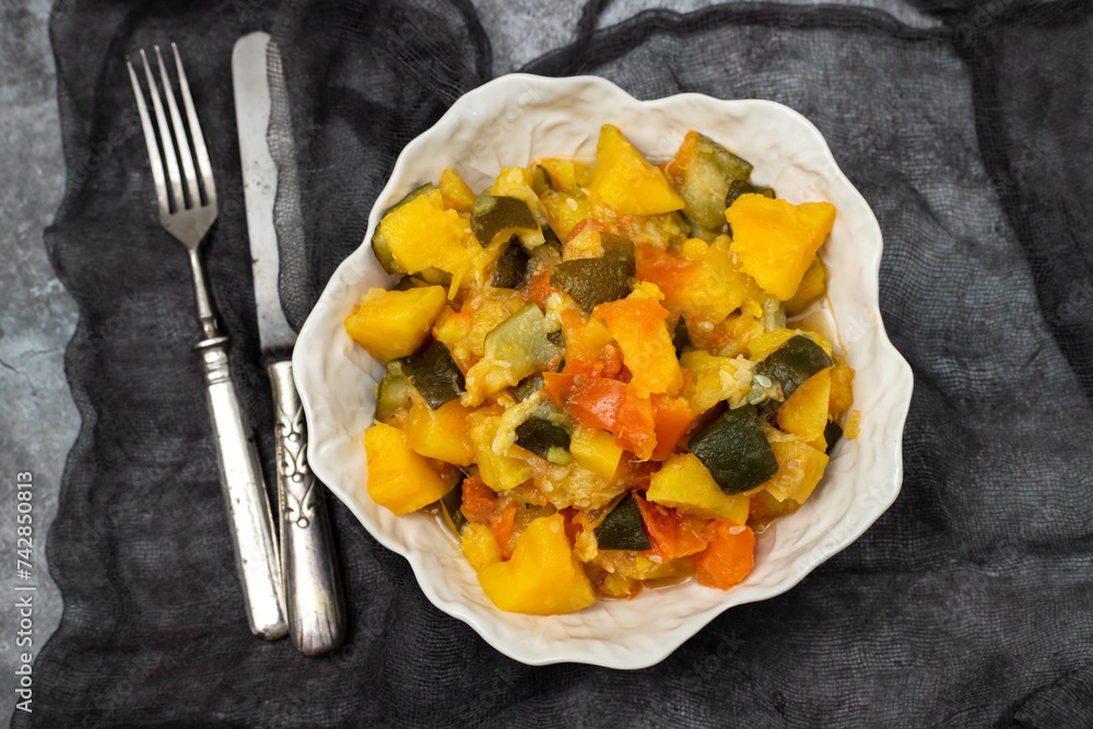 Vegetable stew, vegan healthy food in white bowl. Top view. Vegetable stew, vegan healthy food in white bowl. Top view.