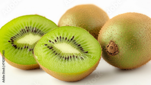 Realistic whole and half kiwi fruit on white background