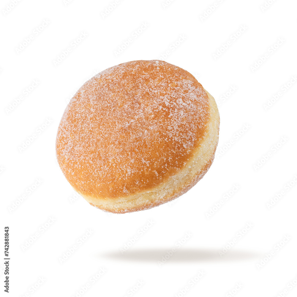 Naklejka premium Single fresh baked donut sprinkled with sugar powder flying isolated on white background.