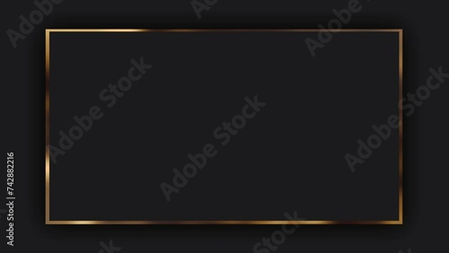 On a dark grey background, a dark grey rectangle frame with a gold border, free space for text and product advertising. Animation of a luxury frame in a minimalism style.