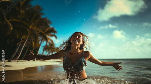 Obraz na płótnie Young woman running into sea with splashes, Happy beautiful woman running on the beach w salonie