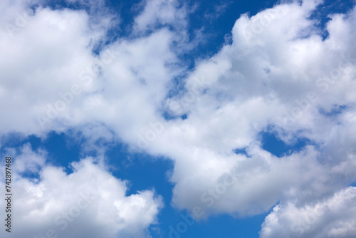 Blue sky with sunlight and beautiful white clouds.