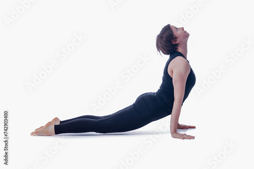 Surya Namaskar (Sun Salutation) Chaturanga Variation, Ashtanga yoga  Side view of woman wearing sportswear doing Yoga exercise against white background.