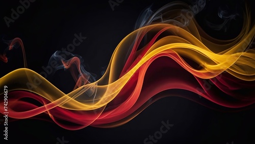 Yellow and red smokes flowing on dark background 
