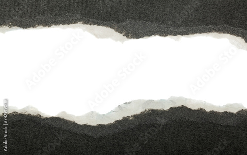 Torn black paper isolated on white background.