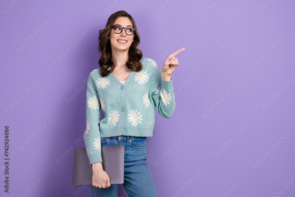 Photo of young sales manager young woman in casual shirt directing finger crm system application isolated on violet color background Photo of young sales manager young woman in casual shirt directing finger crm system application isolated on violet color background