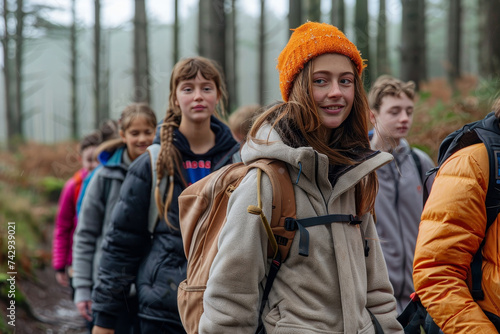 A group of winter hikers, bundled up in warm jackets and scarves, stand amidst the towering trees of the forest, their human faces filled with determination and awe at the beauty of the great outdoor