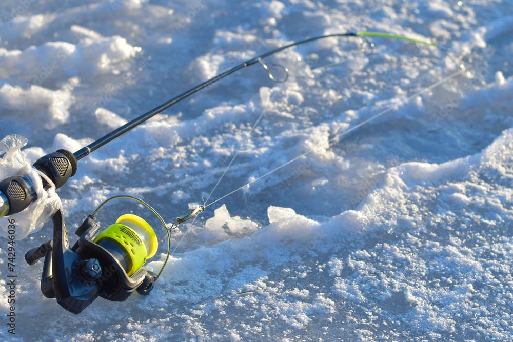 Ice fishing fresh fish trout, winter activities, and ice fishing equipment Ice fishing fresh fish trout, winter activities, and ice fishing equipment