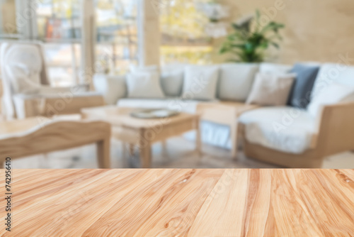 Wooden table top with home background, lights bokeh