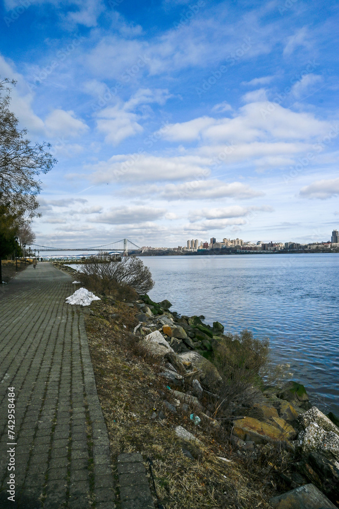 he George Washington Bridge stands majestic against a dynamic sky, seen from a tranquil spot in Edgewater, NJ. he George Washington Bridge stands majestic against a dynamic sky, seen from a tranquil spot in Edgewater, NJ.