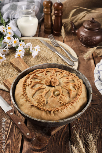 Tatar national pie balish on a wooden background photo