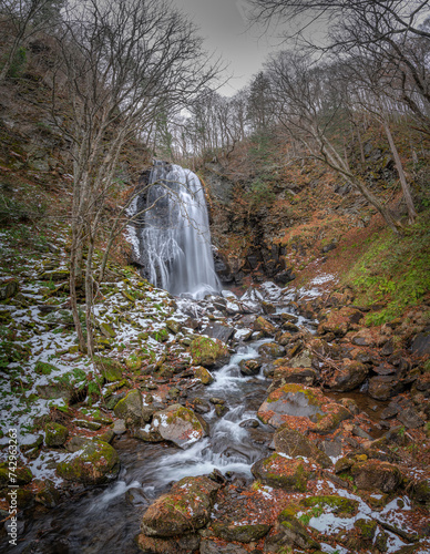 View of a small waterfall along the river flowing toward the Hibara lake, Kitashiobara, Yama District, Fukushima, Japan. photo