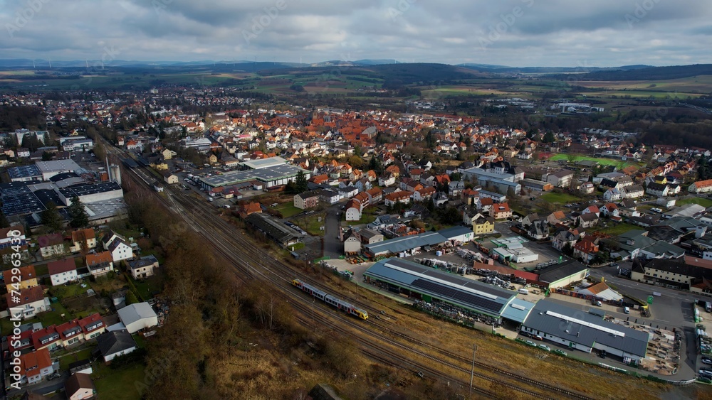 Aerial around the old town of the city Alsfeld in Hesse, Germany on a sunny day day in winter	