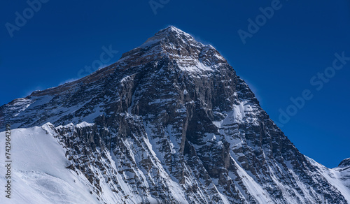 View of the Mount Everest peak, the world highest peak on the Mahalangur Himal sub-range of the Himalayas range, China-Nepal border, Nepal. photo