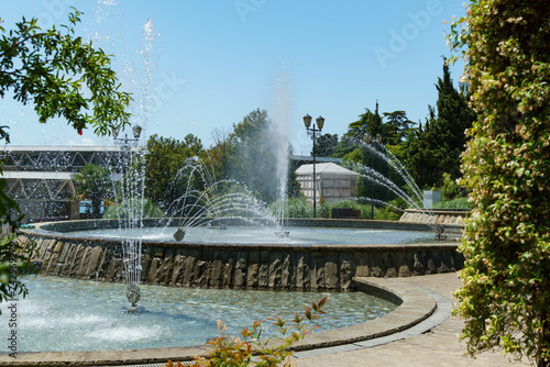 Gorgeous set of fountains next to the Festivalny concert hall. Fountains in a landscaped city park along Kurortny Prospekt in Sochi. photo