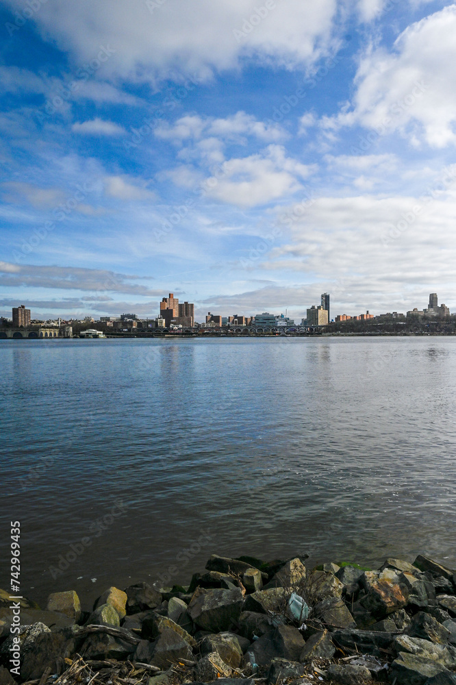  Clear blue skies over the modern skyline of Upper Manhattan, viewed from the serene shores of Edgewater, NJ.
