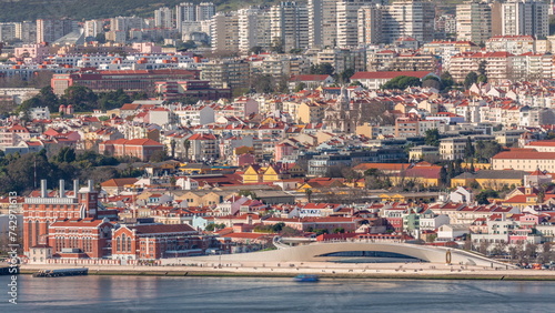 Museu de Arte, Arquitetura and Tecnolocia or MAAT at the Rio Tejo in Belem near museum of electricity aerial timelapse. Lisbon, Portugal photo