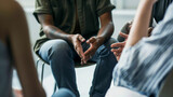 Therapy group, focus on man's hands, concept about the importance of psychotherapy for help and support to solve mental problems and social problems
