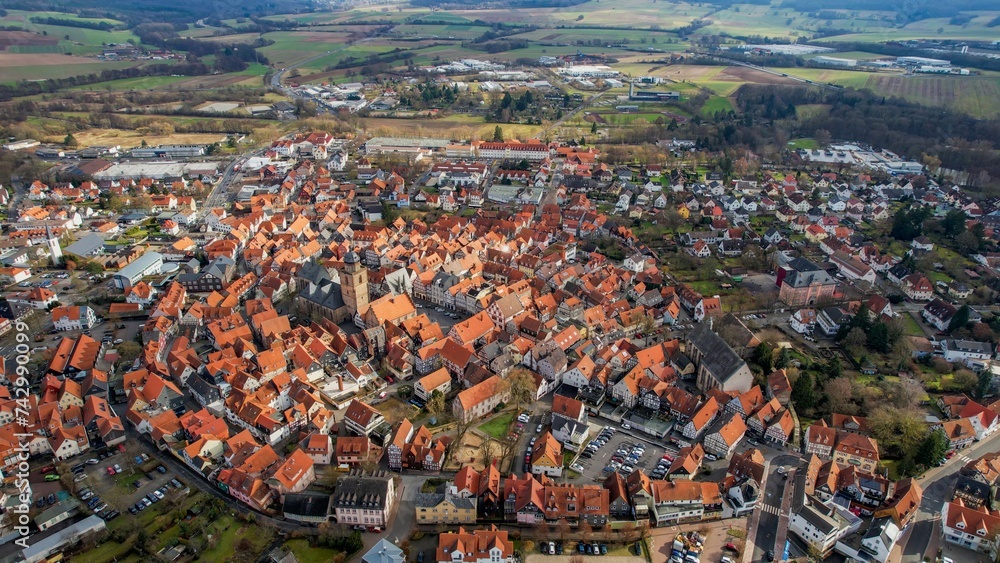 Aerial around the city Alsfeld in Germany on a sunny afternoon in autumn