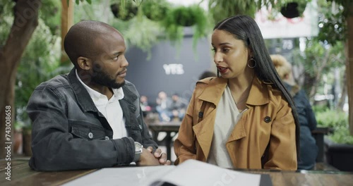 Couple, fight at cafe and angry in conflict, disagreement and toxic relationship with trust problem. Fail, mistake with interracial people arguing, frustrated woman and black man with sorry on date photo